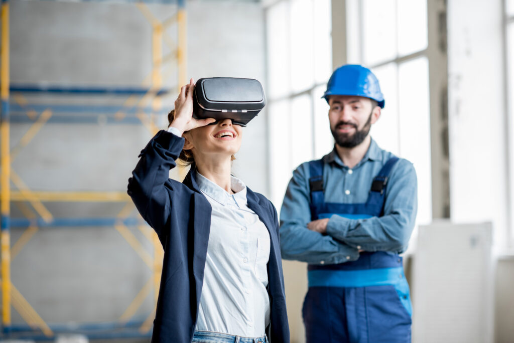 Business woman viewing a construction site using a VR set